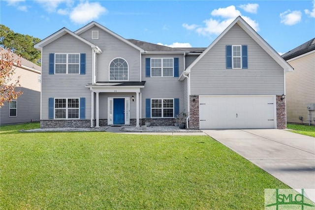 view of front of home featuring a garage and a front lawn