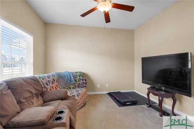 carpeted living room featuring ceiling fan