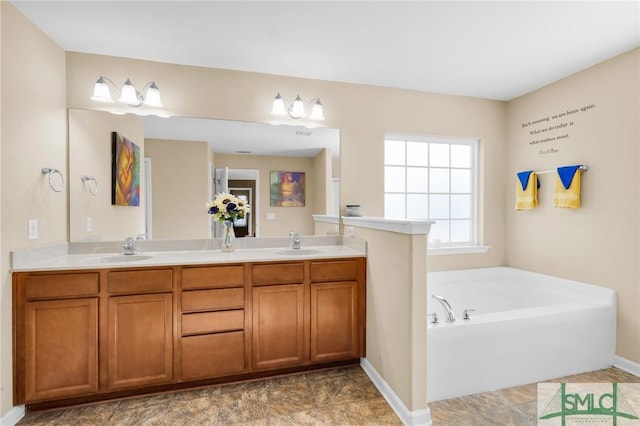 bathroom with a bathing tub and vanity