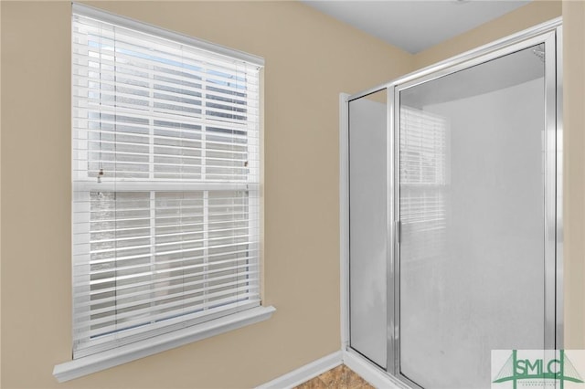 bathroom with a shower with shower door