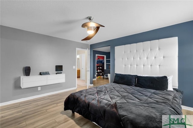 bedroom with hardwood / wood-style floors and ceiling fan