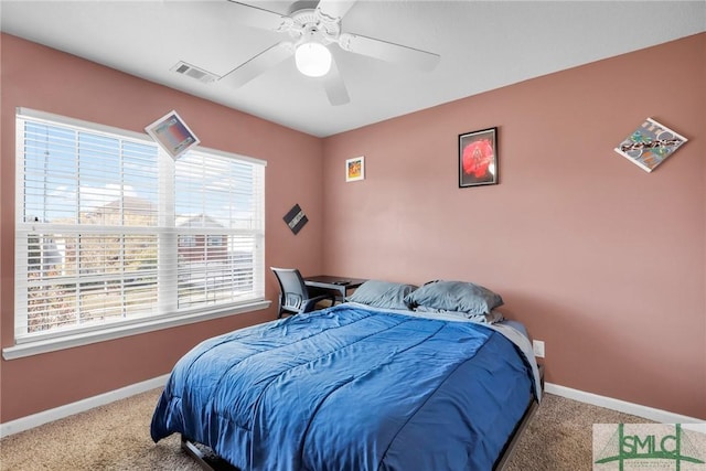 bedroom with ceiling fan and carpet floors