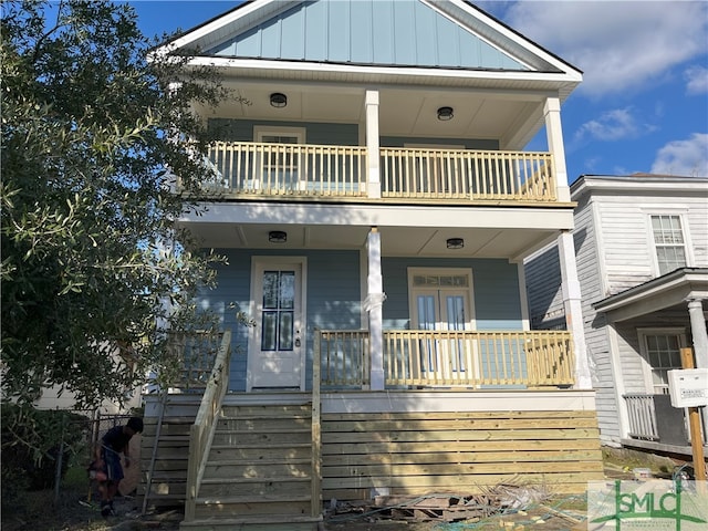 view of front of house with a balcony and covered porch