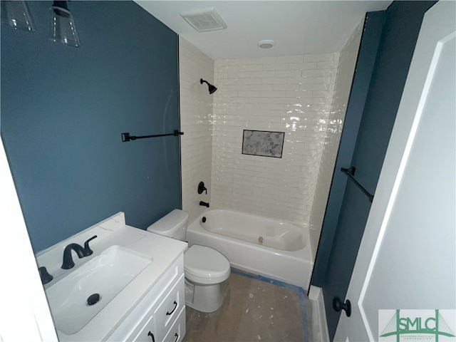 full bathroom featuring vanity, toilet, and tiled shower / bath