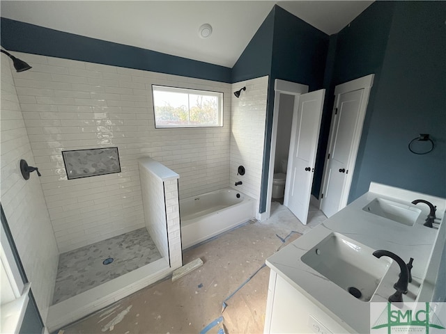 full bathroom with vanity, plus walk in shower, and toilet