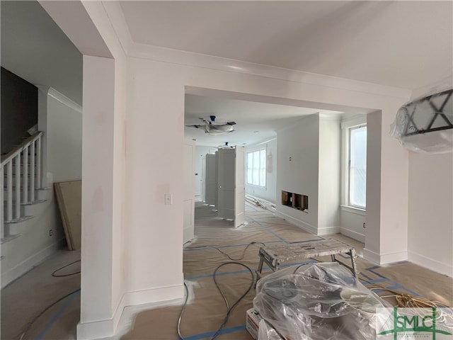 carpeted living room with ornamental molding