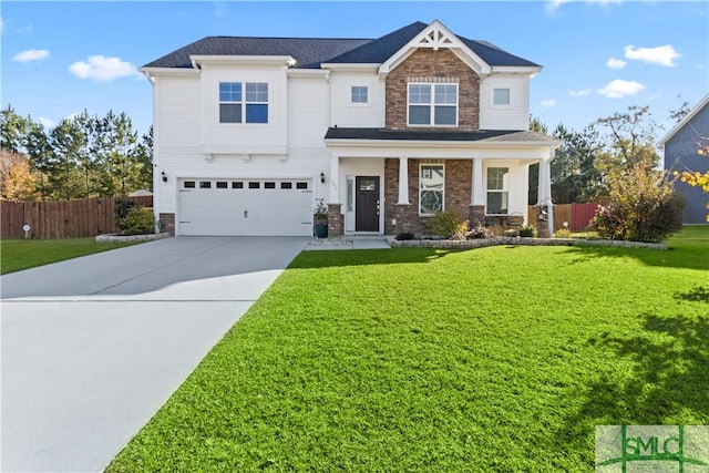 craftsman-style house with a garage and a front lawn