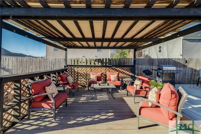 wooden terrace featuring grilling area and an outdoor living space