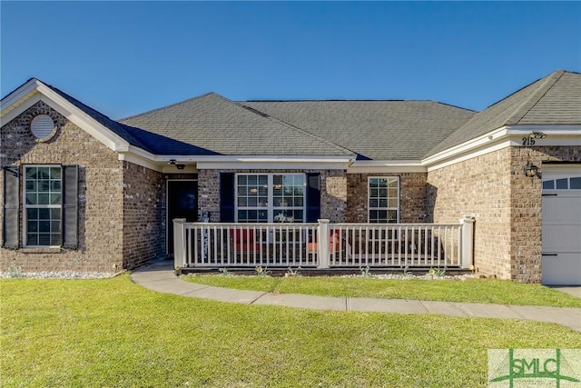 ranch-style house with a garage and a front yard