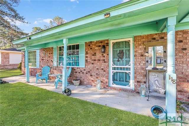 entrance to property featuring covered porch