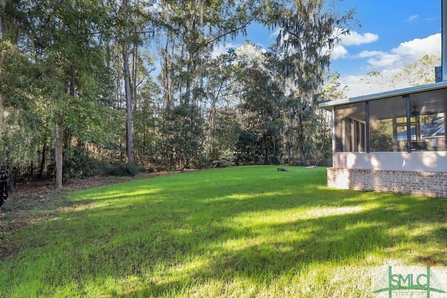 view of yard featuring a sunroom