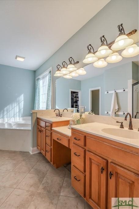 bathroom featuring tile patterned flooring, vanity, and a bath