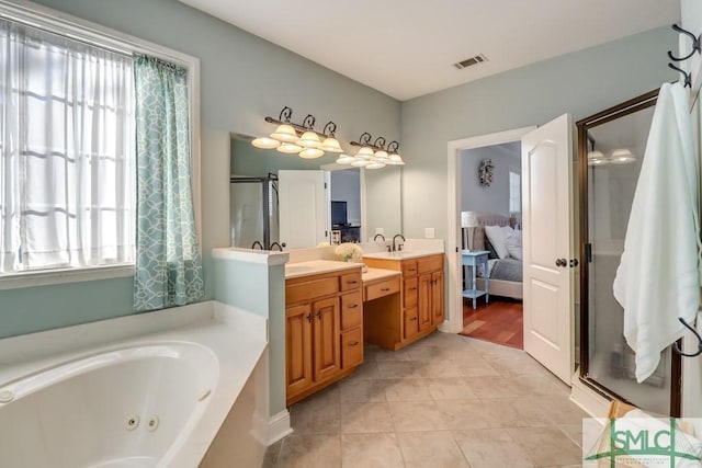 bathroom with vanity, tile patterned flooring, and shower with separate bathtub