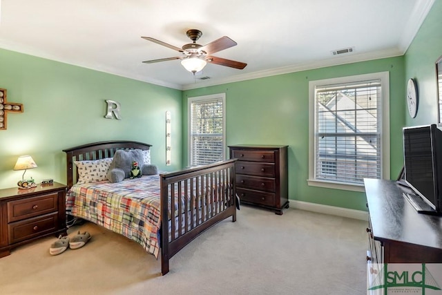 bedroom with multiple windows, ornamental molding, and light colored carpet