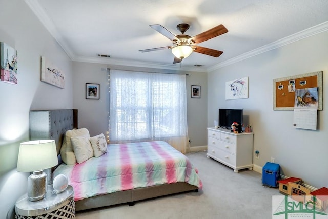 bedroom featuring crown molding, light colored carpet, and ceiling fan