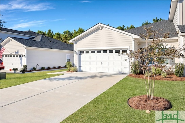 ranch-style home with a front yard and a garage