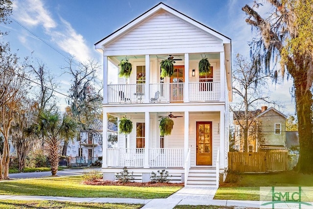 view of front of home with a porch and a front lawn