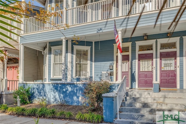 doorway to property featuring a porch