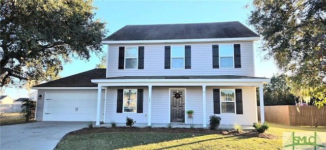 front of property with a front yard and a garage