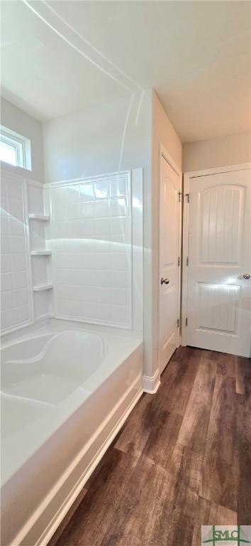 bathroom with  shower combination and hardwood / wood-style flooring