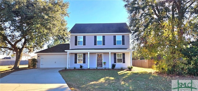 colonial home with a garage and a front lawn