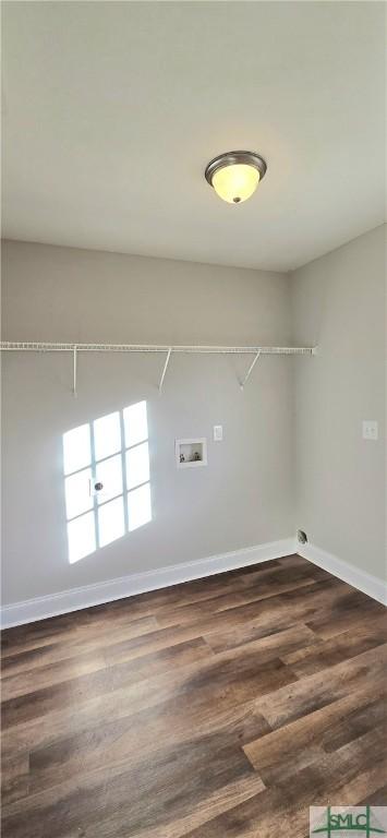 laundry room with hookup for a washing machine and dark wood-type flooring