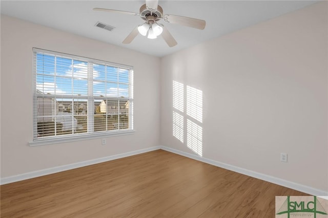 unfurnished room with wood-type flooring and ceiling fan