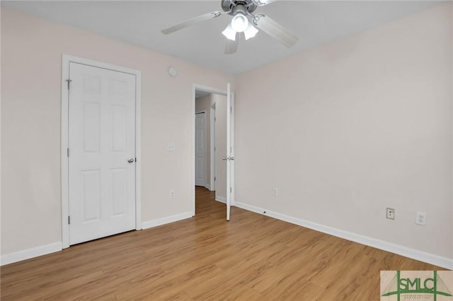 unfurnished bedroom featuring ceiling fan and light hardwood / wood-style floors