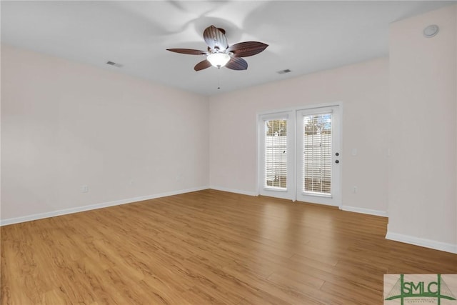 unfurnished room featuring ceiling fan and light hardwood / wood-style flooring