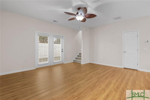 empty room featuring ceiling fan and light wood-type flooring