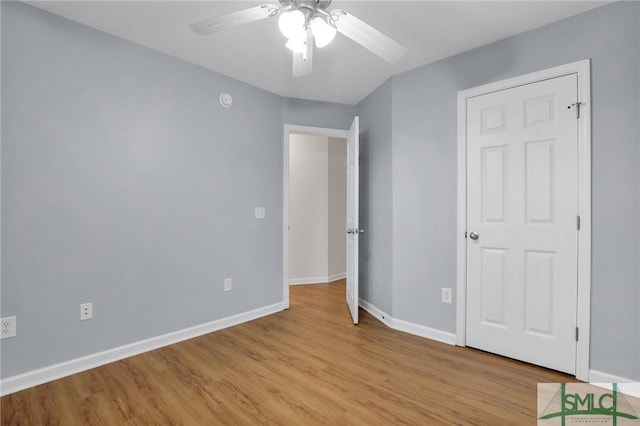 unfurnished bedroom featuring ceiling fan and light wood-type flooring