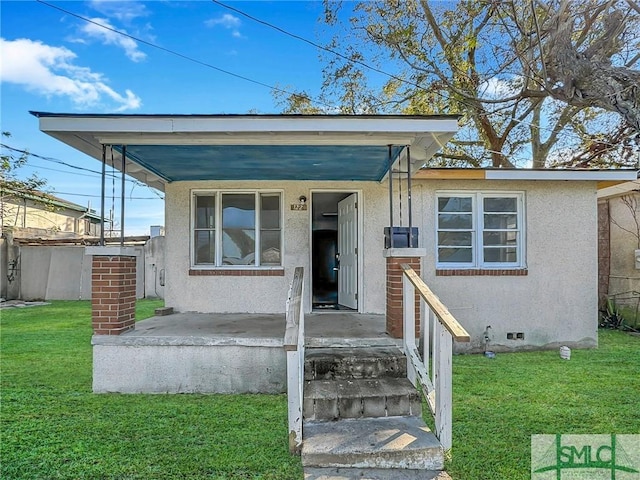 bungalow with a front yard