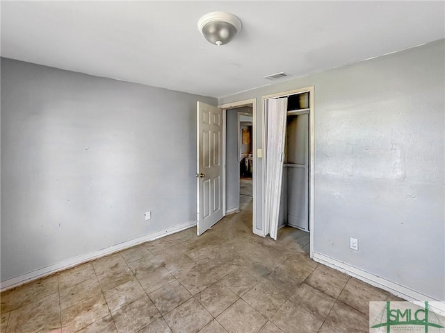 unfurnished bedroom with a closet