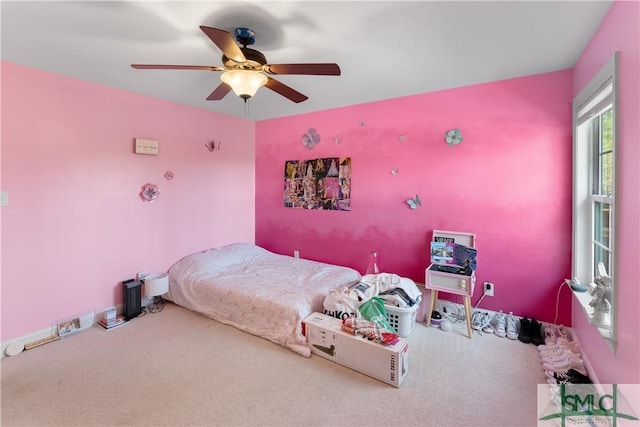 carpeted bedroom featuring ceiling fan