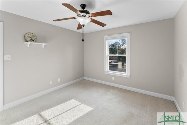 empty room featuring carpet flooring and ceiling fan