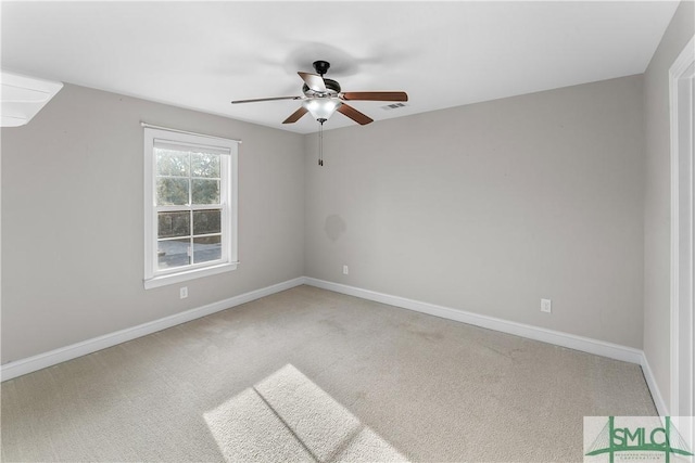 spare room with carpet flooring and ceiling fan