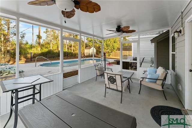 sunroom featuring ceiling fan