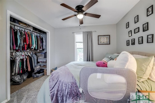 bedroom with ceiling fan, carpet floors, and a closet