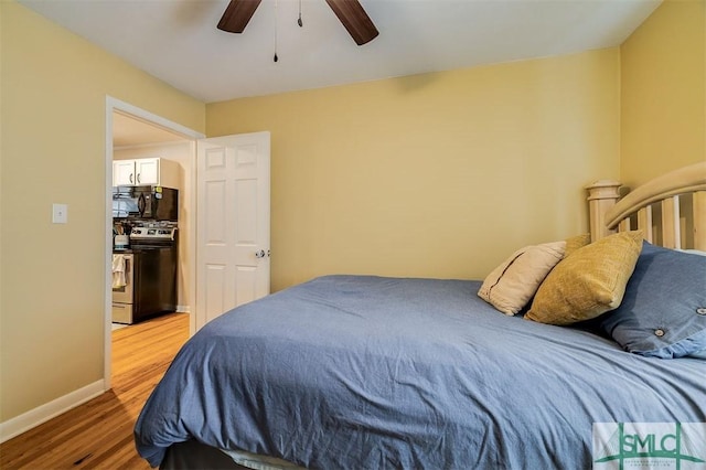 bedroom featuring hardwood / wood-style floors and ceiling fan