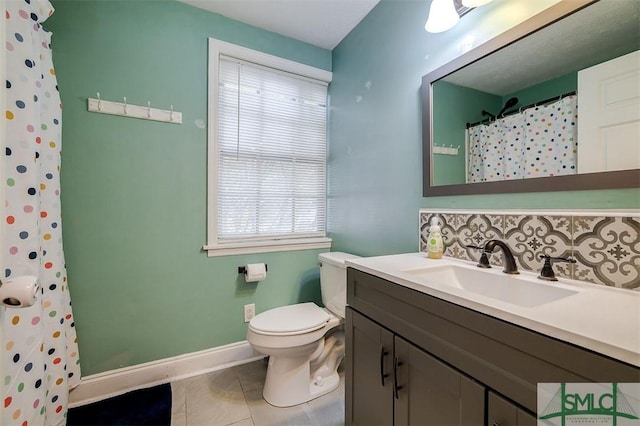 bathroom featuring vanity, tile patterned floors, decorative backsplash, toilet, and walk in shower