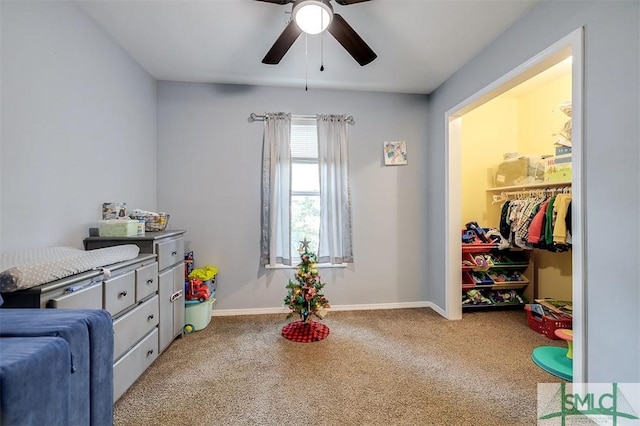 game room featuring light carpet and ceiling fan