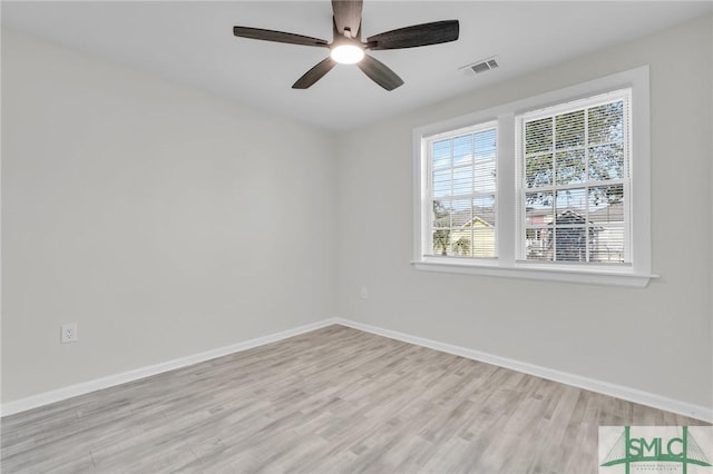 unfurnished room with ceiling fan and light hardwood / wood-style floors