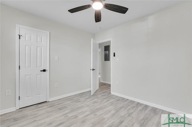 unfurnished room with light wood-type flooring and ceiling fan