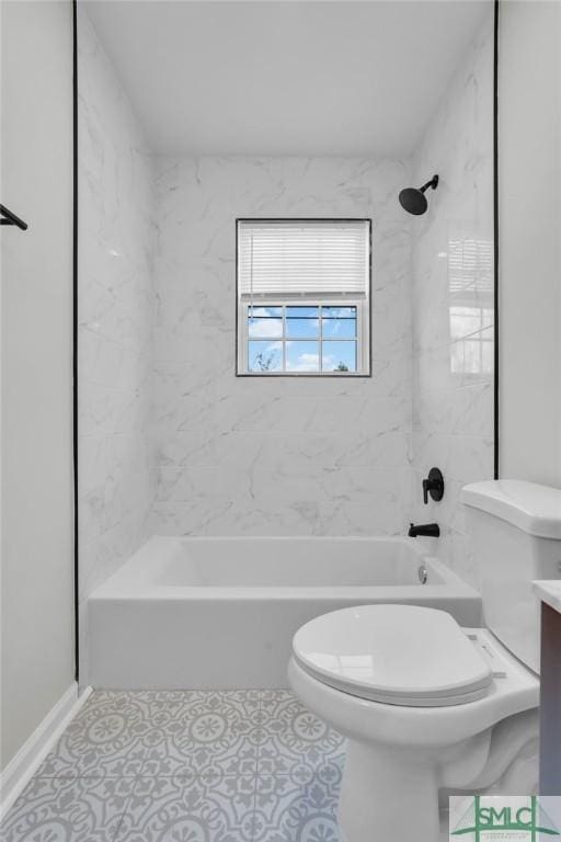 full bathroom featuring tile patterned floors, vanity, toilet, and tiled shower / bath combo