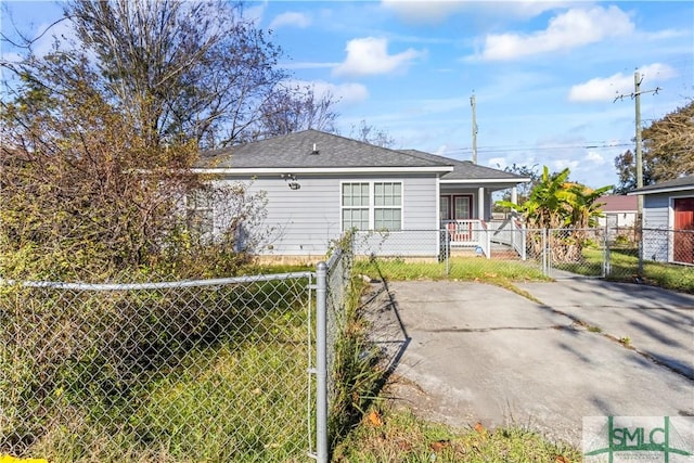 rear view of house featuring a yard