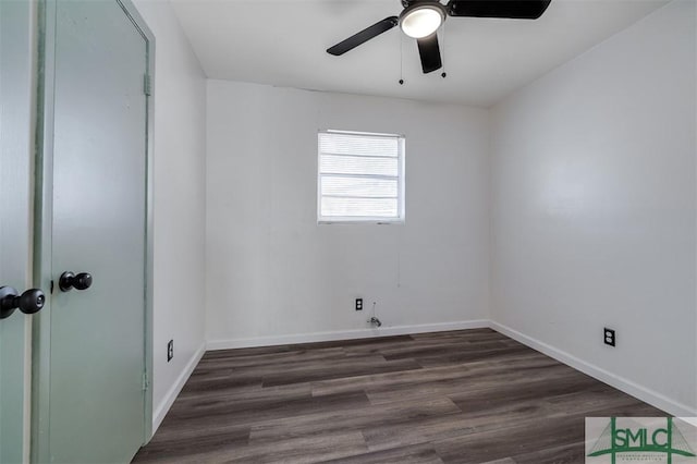 spare room featuring ceiling fan and dark hardwood / wood-style flooring