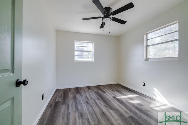 empty room featuring wood-type flooring and ceiling fan