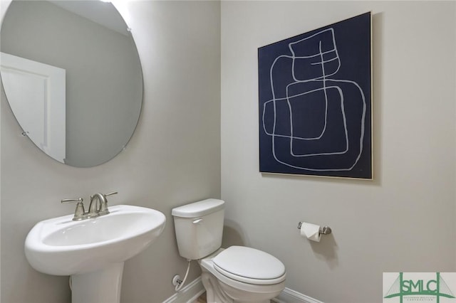 bathroom with toilet and sink