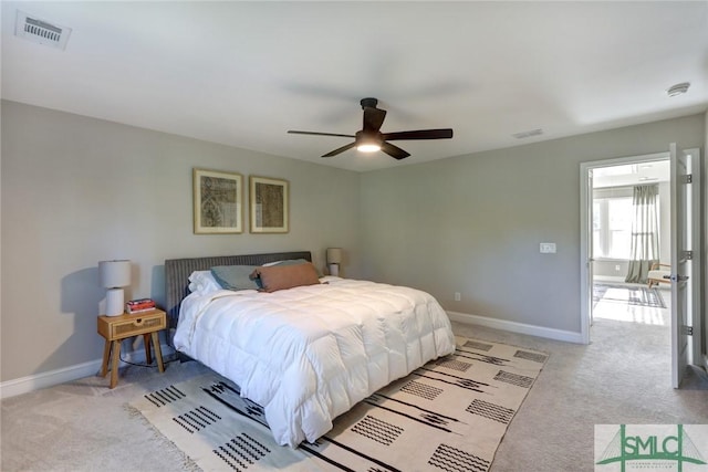 bedroom featuring ceiling fan and light carpet