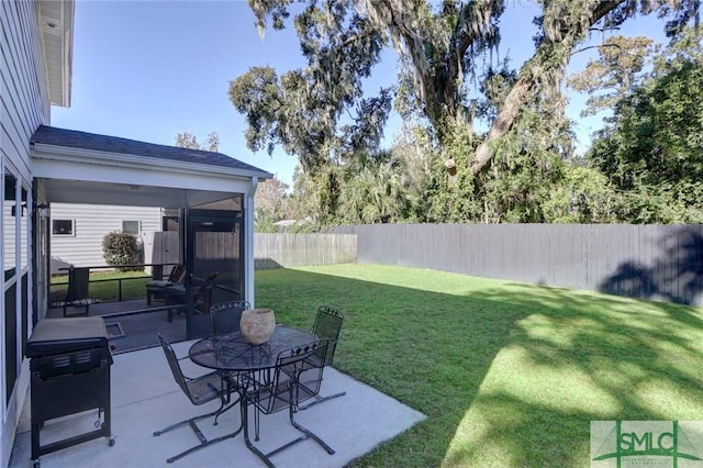 view of yard with a patio and a sunroom